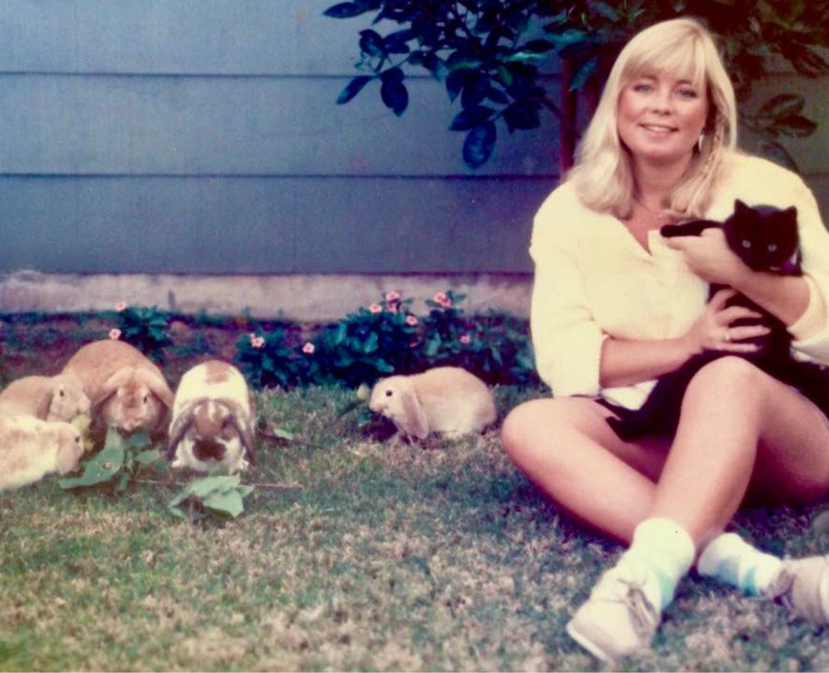 Connie Edwards McGaughy with her kitten and rabbits in 1986.