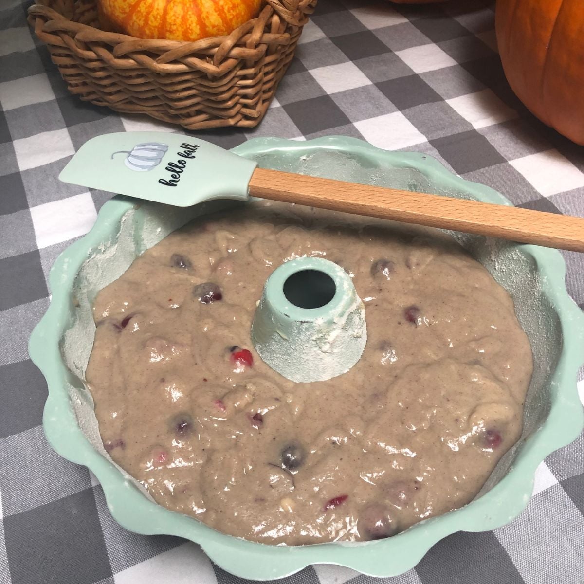 A Bundt pan filled with batter for old fashioned vegan apple sauce cake.