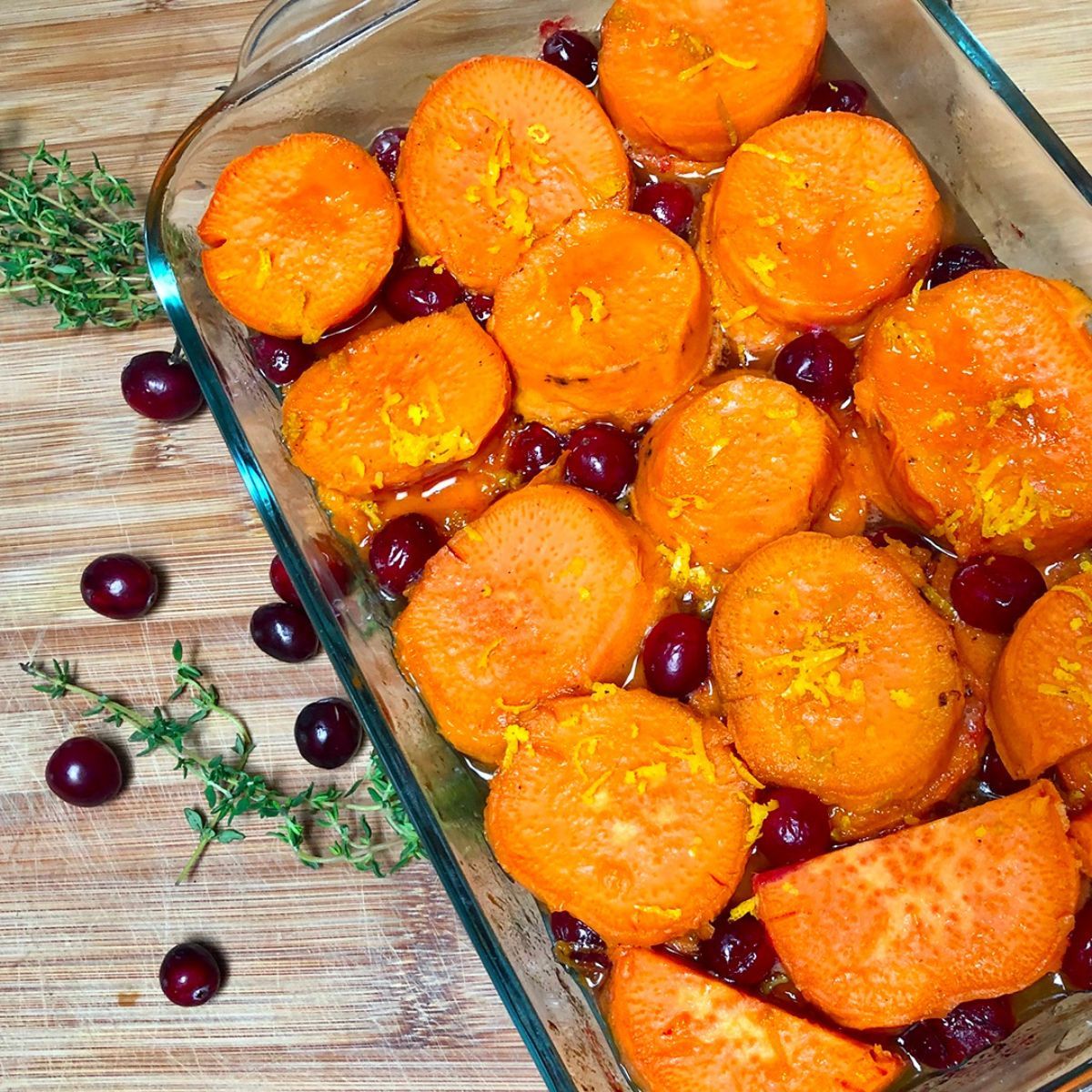 A baking dish with cranberry orange yams (or sweet potatoes).
