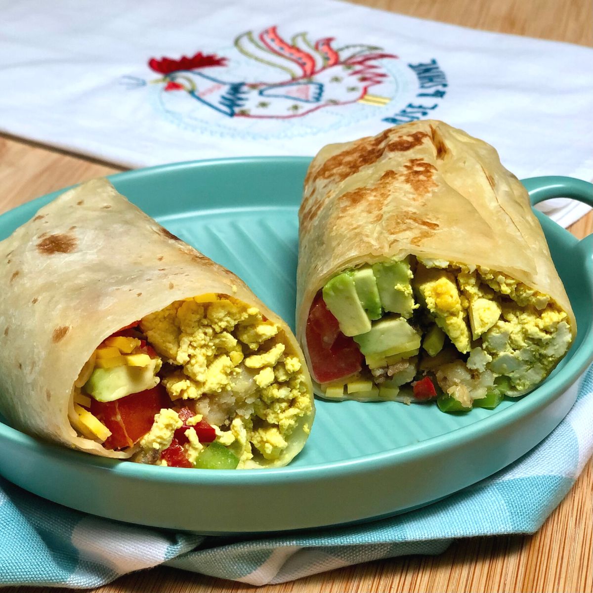 A California breakfast burrito on a plate.