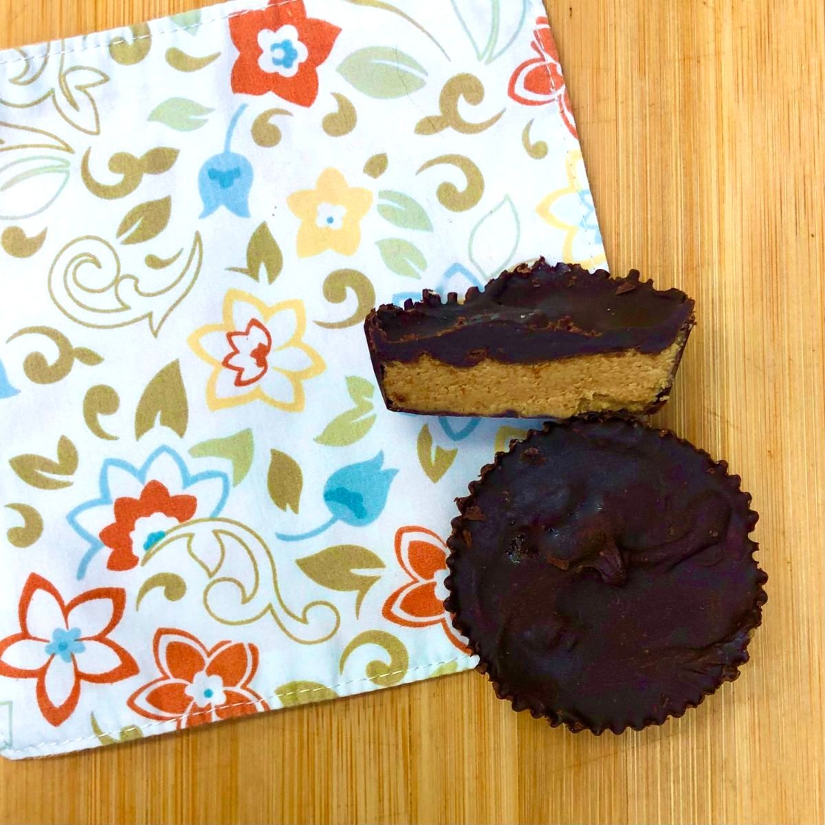 Two vegan peanut butter cups on a napkin.