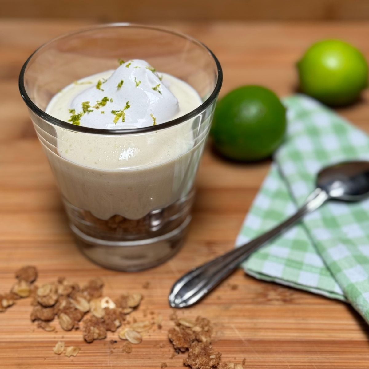 A vegan key lime parfait in a short cocktail glass.