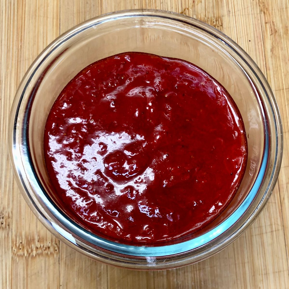 A bowl filled with homemade strawberry compote.