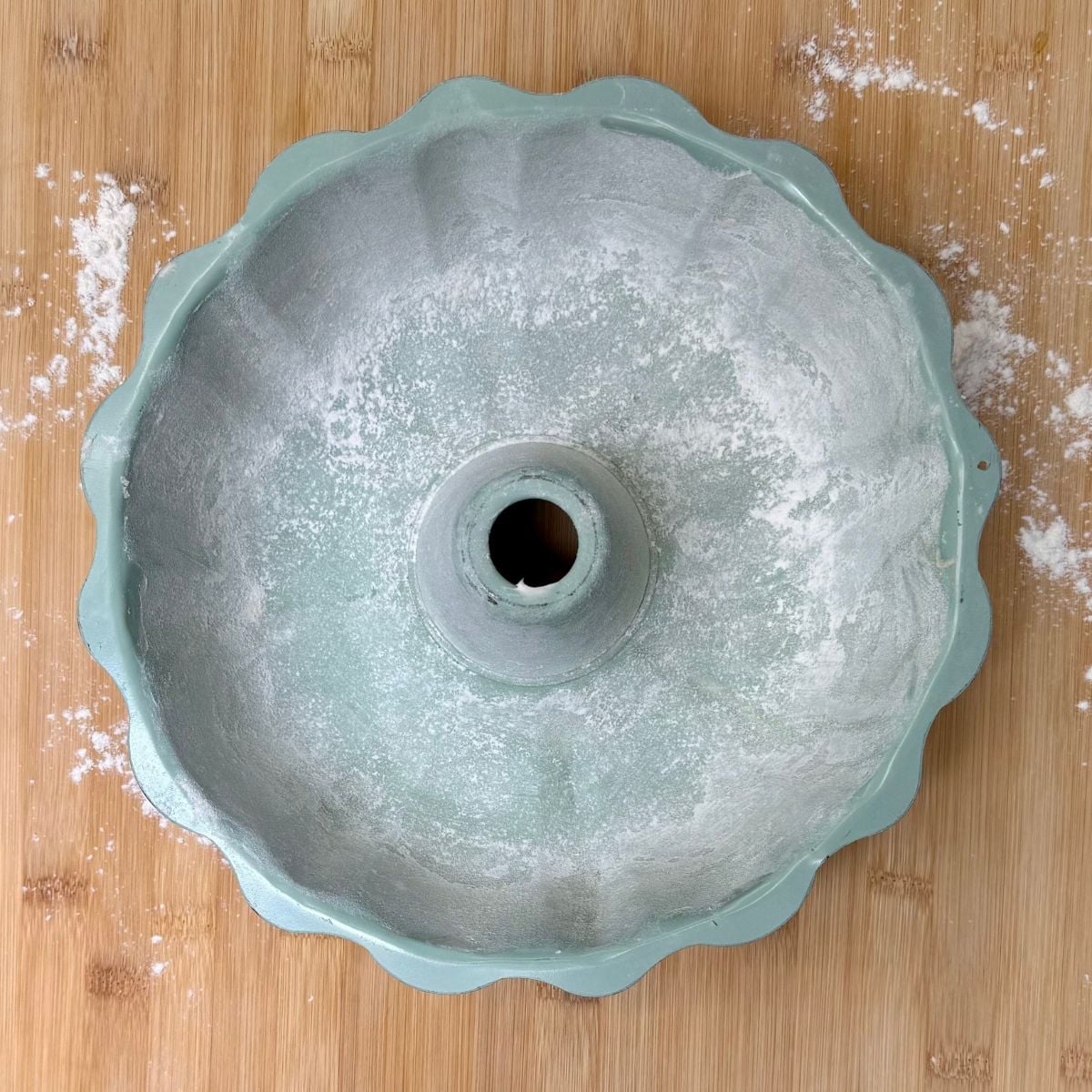 A greased and floured Bundt cake pan.
