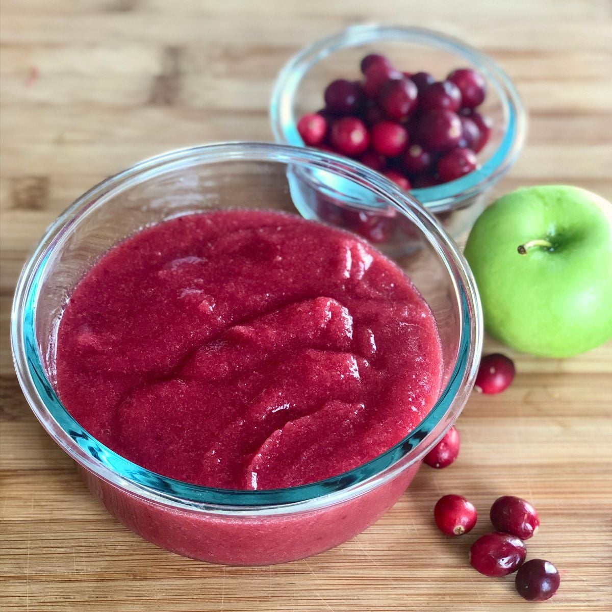 A bowl filled with homemade cranberry applesauce.