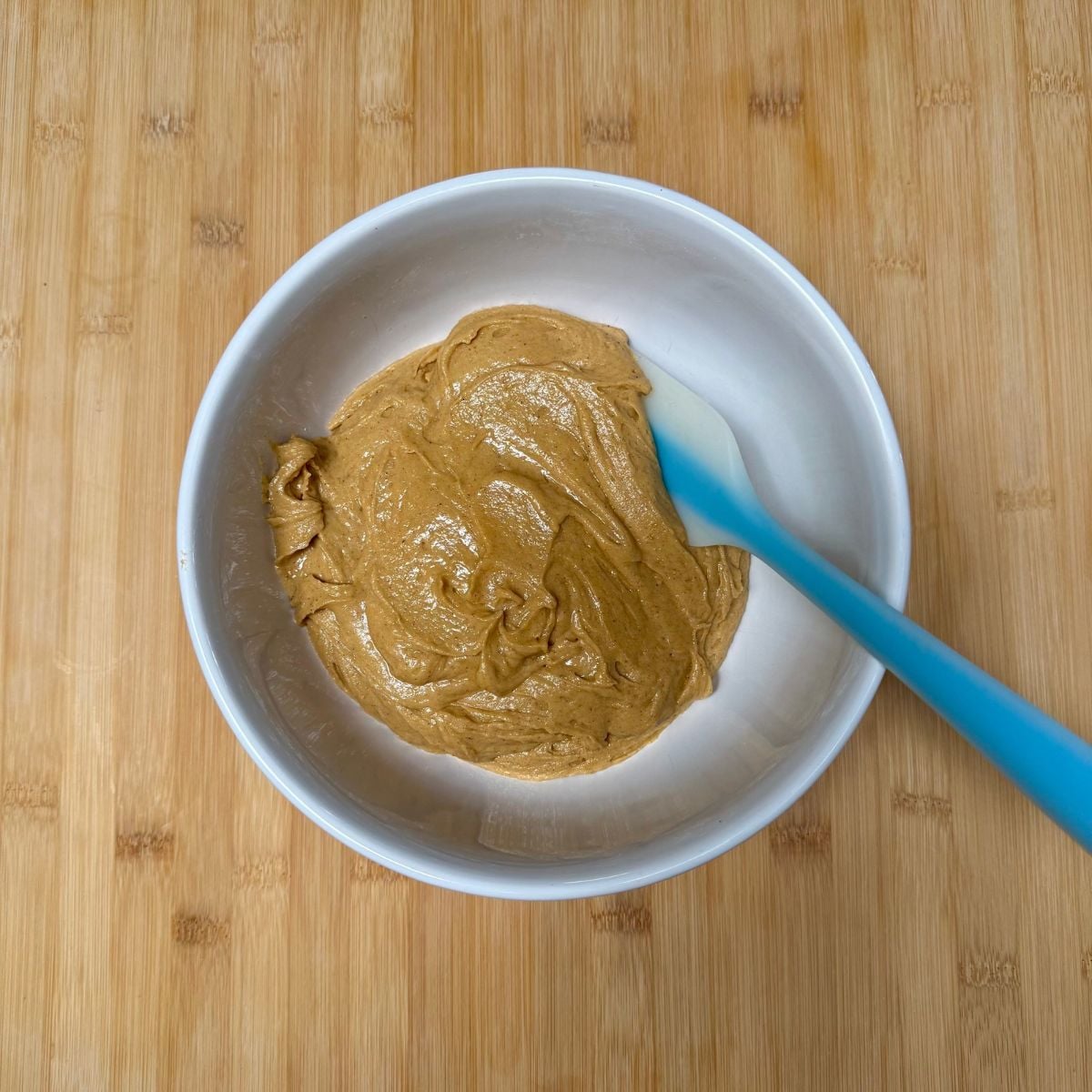 A bowl filled with vegan pumpkin cookie dough.